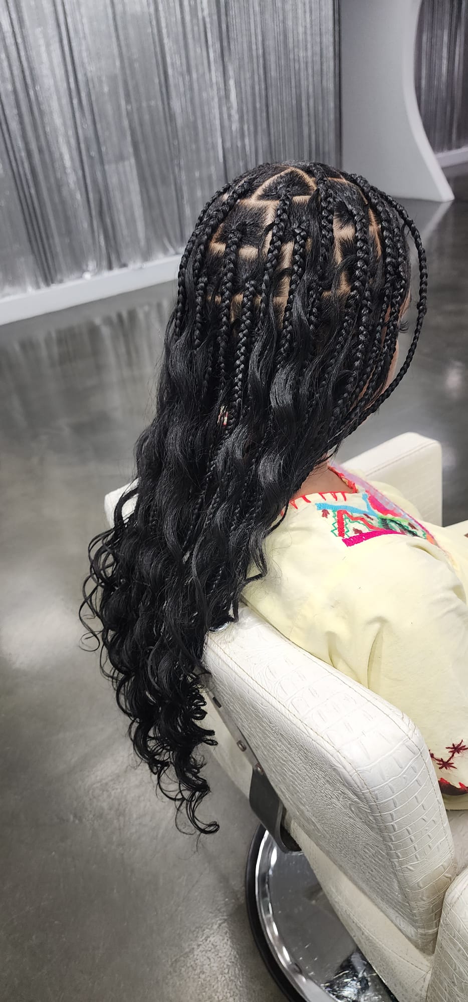 Barber styling a red-bearded man's hair