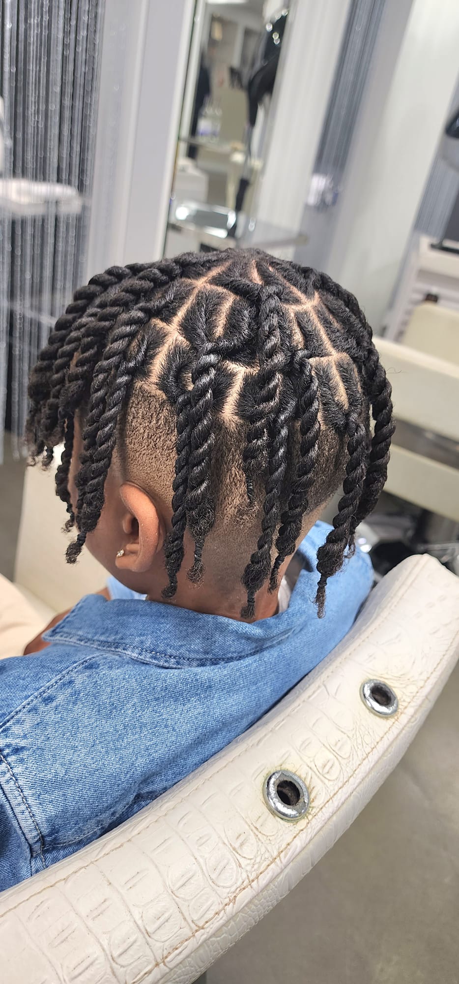 Salon styling station with gold-framed mirrors